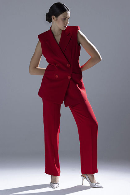 Picture of Sleeveless double-breasted red jacket with matching pants and button detailing.