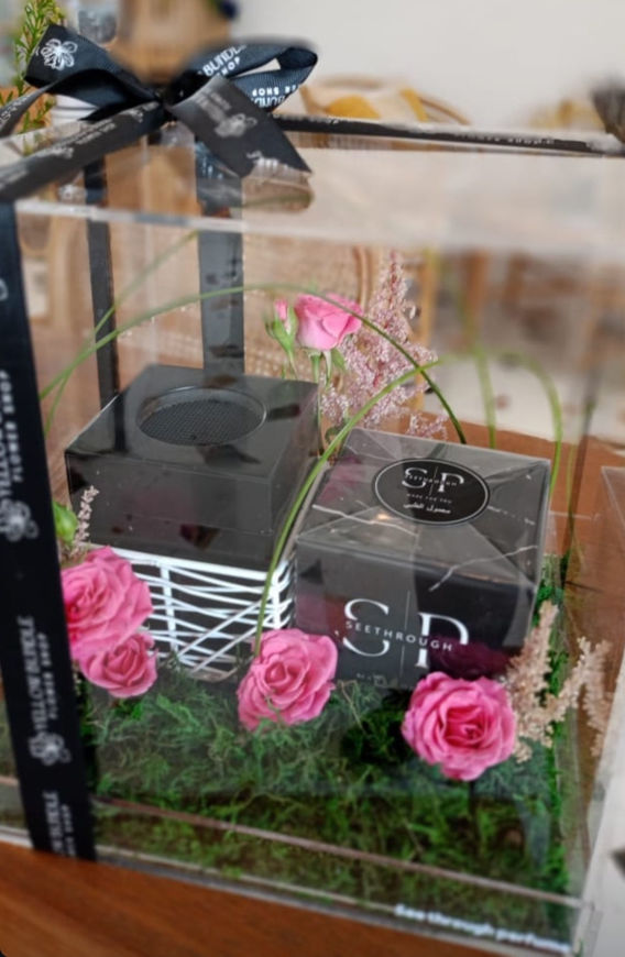 Picture of A box of perfume and smoke