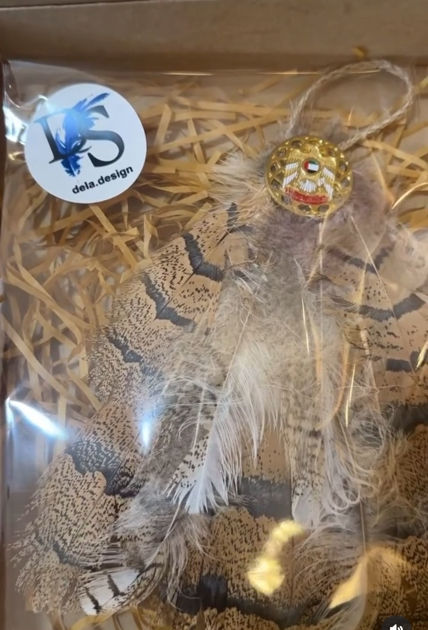 Picture of Hanging from the feathers of the Houbara for the car