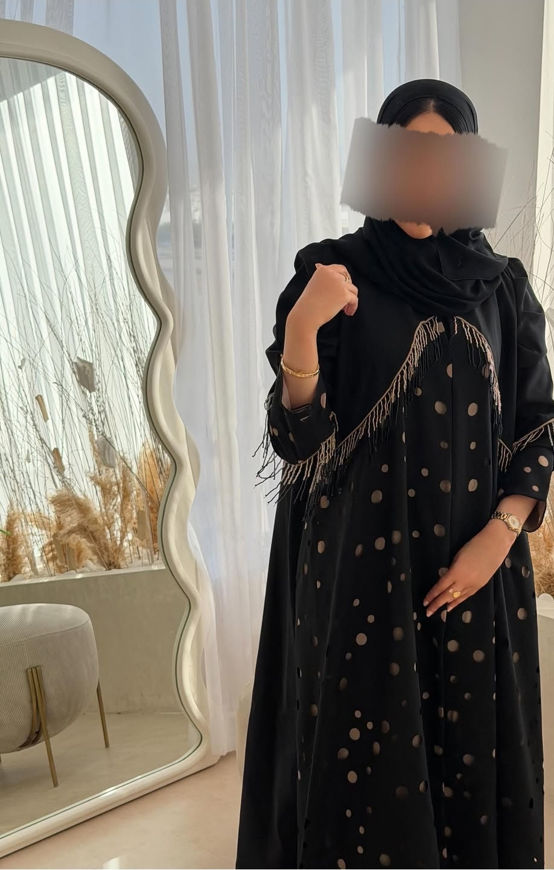 Picture of Abaya for trips and occasions embroidered with golden crepe place with Sheila